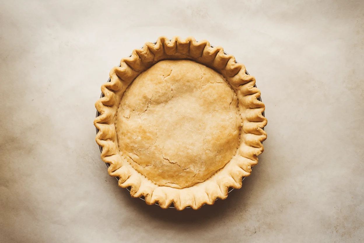 Final baked pie crust with a golden, flaky texture